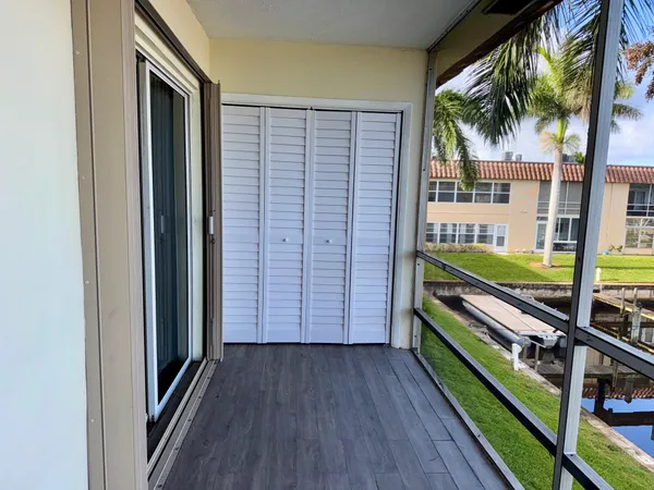 a view of balcony and wooden floor