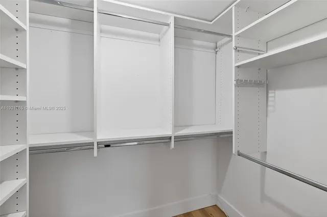 a view of an empty walk in closet