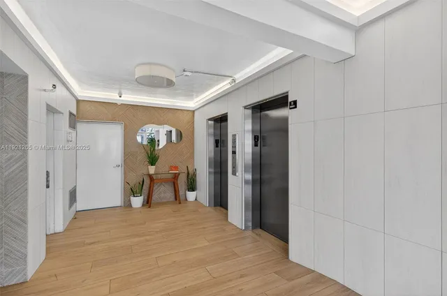 a view of staircase with wooden floor and plant
