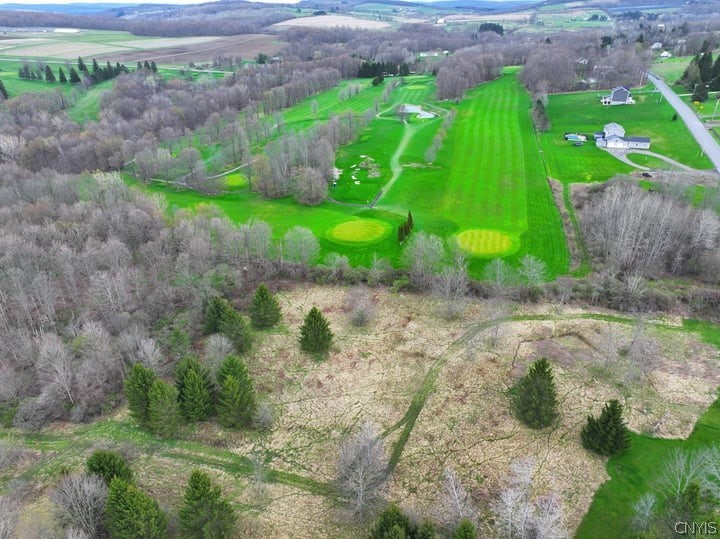 Aerial view of land bordering golf course