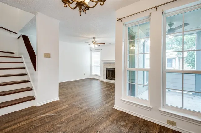 a view of an entryway with wooden floor and windows