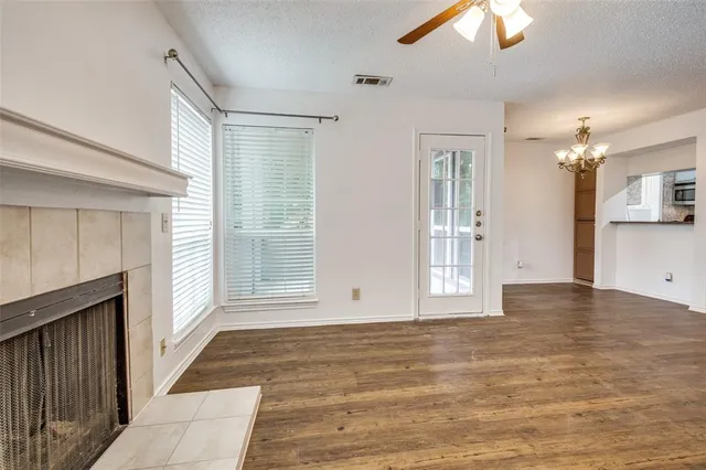 a view of wooden floor and windows in a room