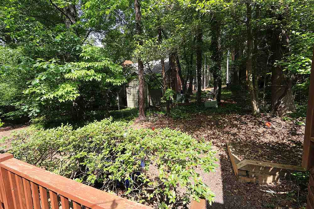 552 Weathergreen Drive Raleigh, NC 27615 - Photo 20 of 26 There is no townhome directly behind this deck. Backyard Area