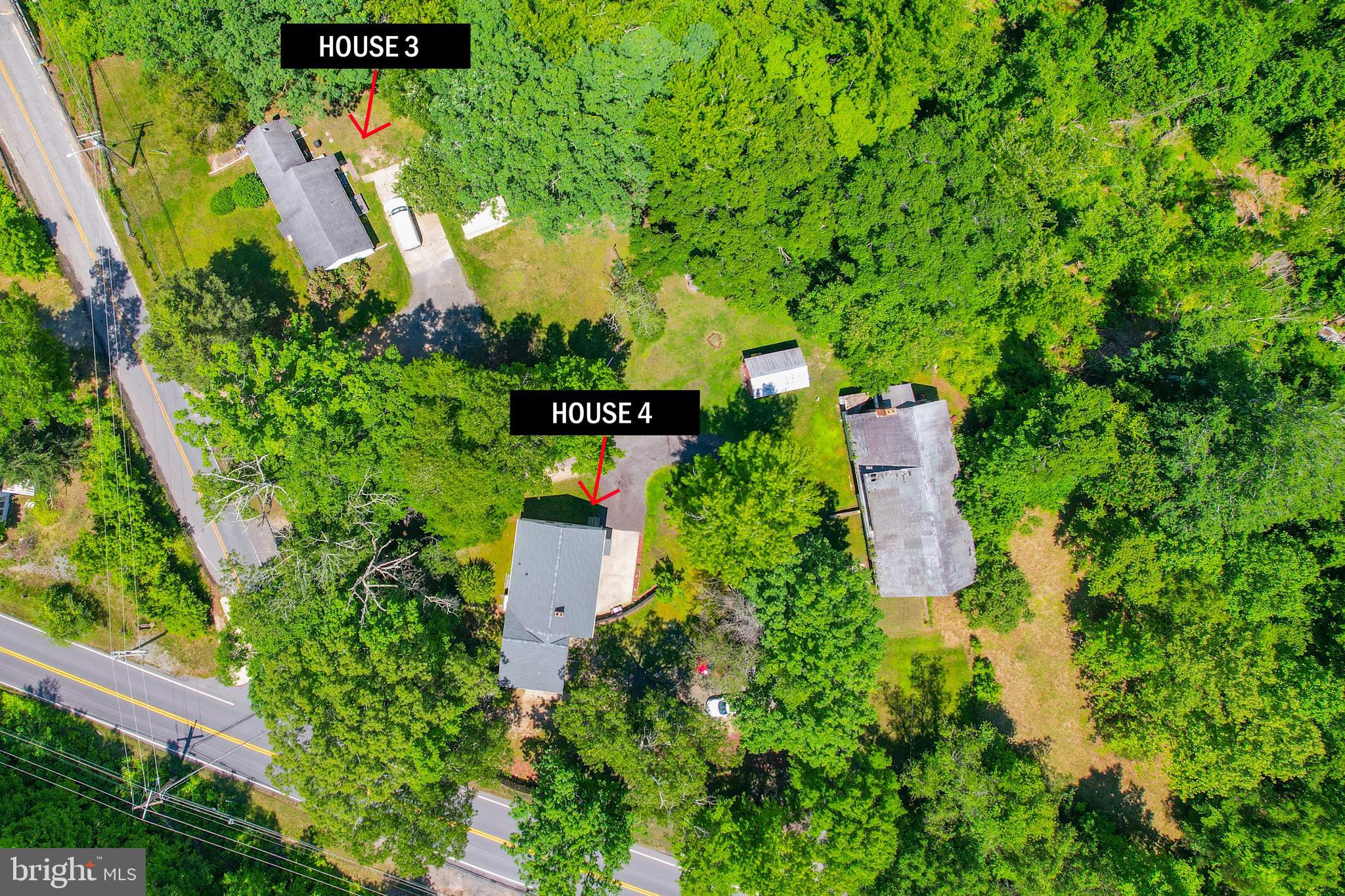 5709 Plummer Lane Lothian, MD 20711 - Photo 2 of 15 an aerial view of residential house with outdoor space and trees all around