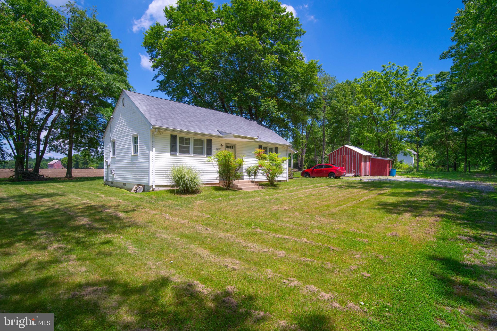 5709 Plummer Lane Lothian, MD 20711 - Photo 5 of 15 a view of a house with a backyard