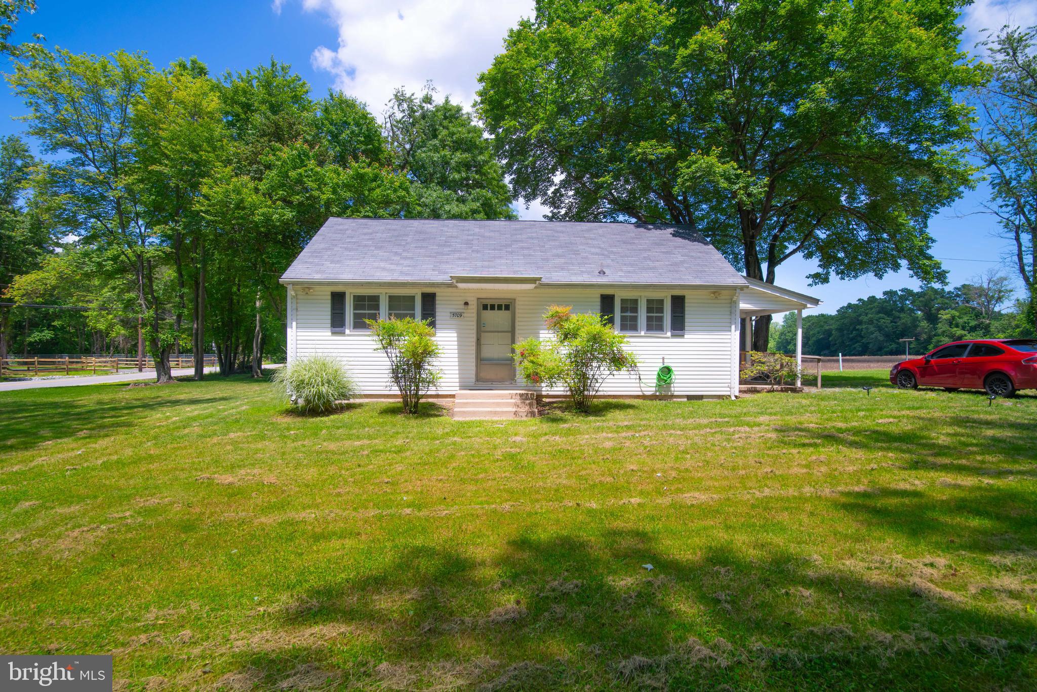 5709 Plummer Lane Lothian, MD 20711 - Photo 6 of 15 a front view of a house with a garden