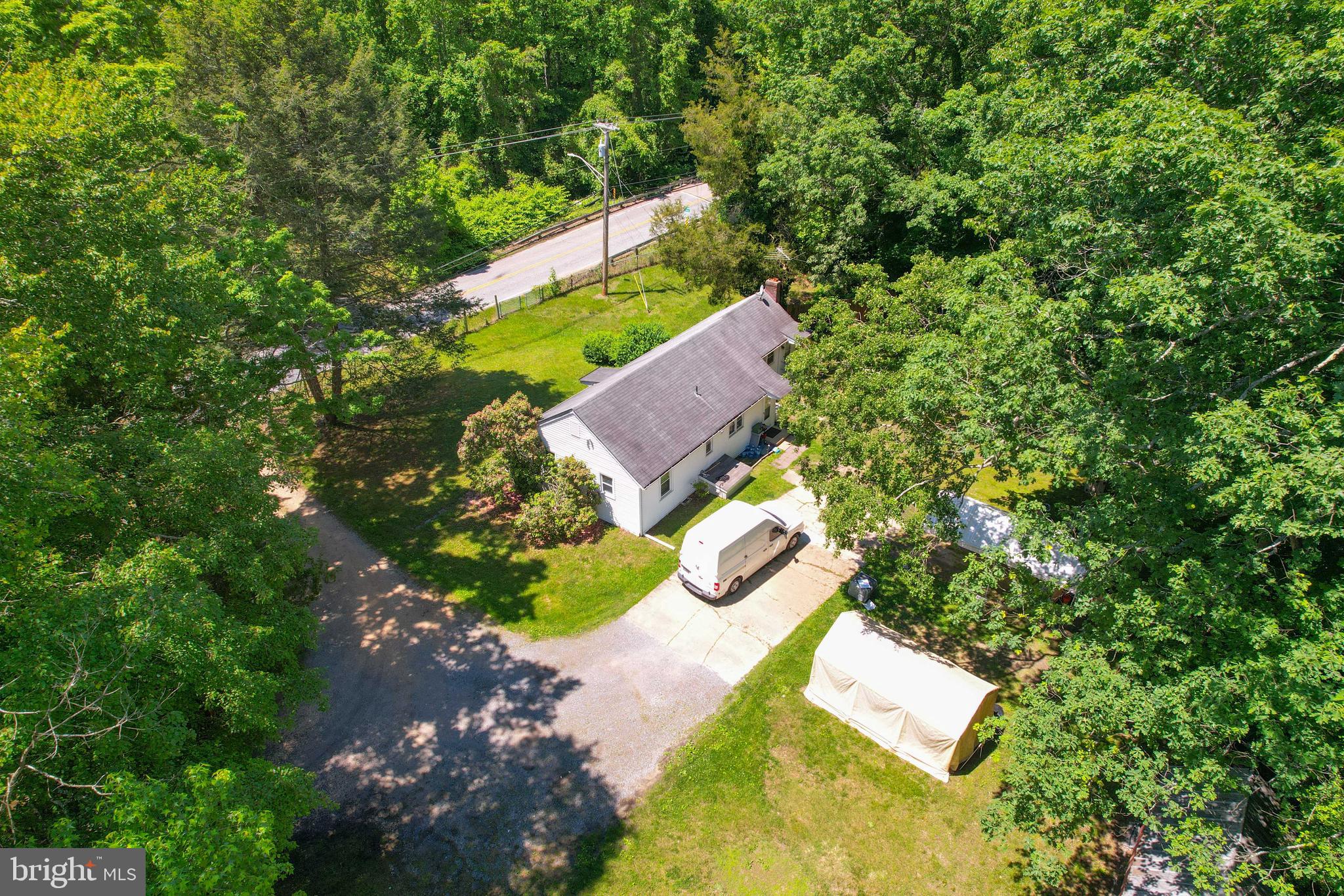 5709 Plummer Lane Lothian, MD 20711 - Photo 9 of 15 an aerial view of a house with a yard