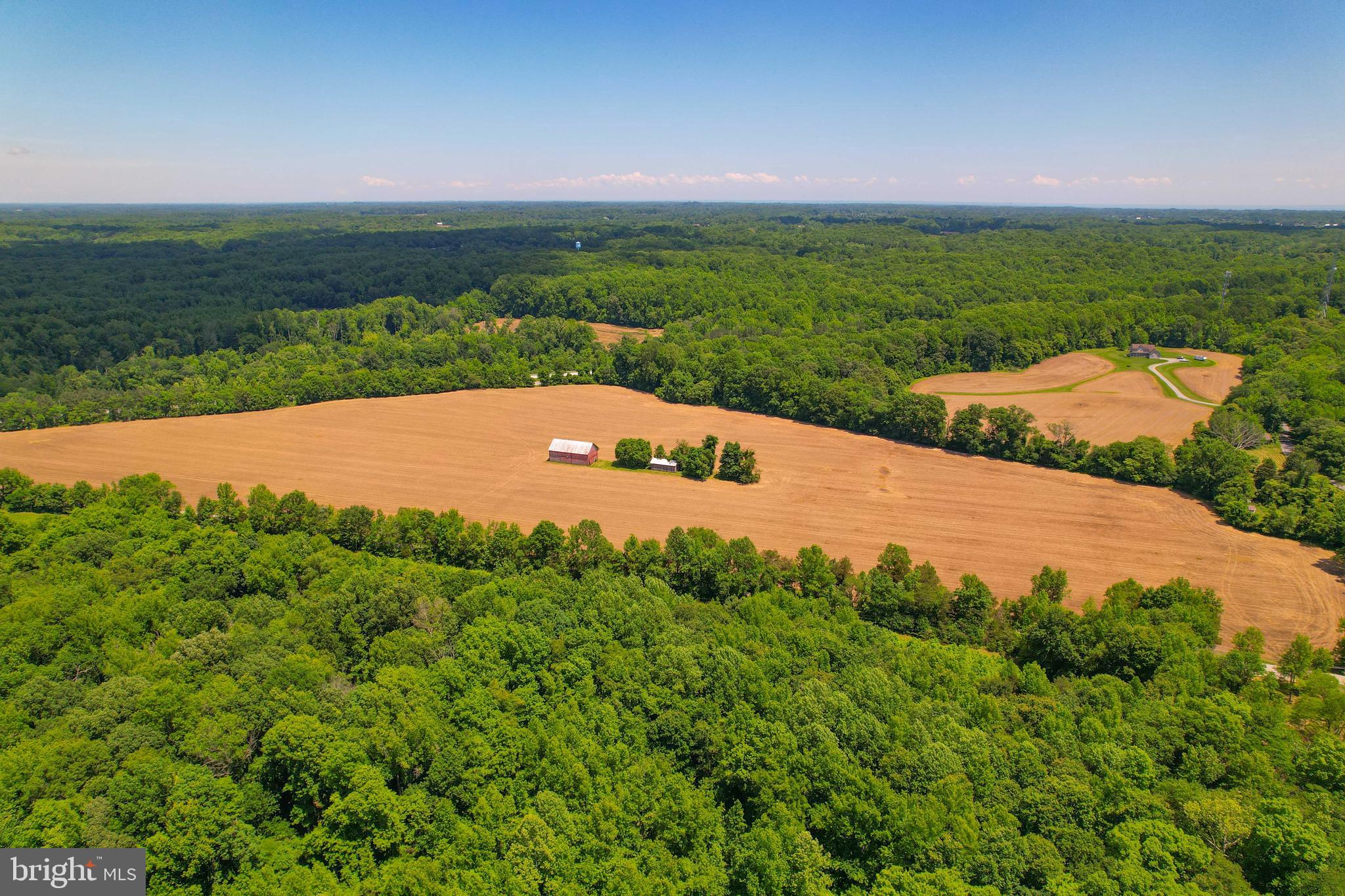 5709 Plummer Lane Lothian, MD 20711 - Photo 10 of 15 a view of a field with an ocean in the background
