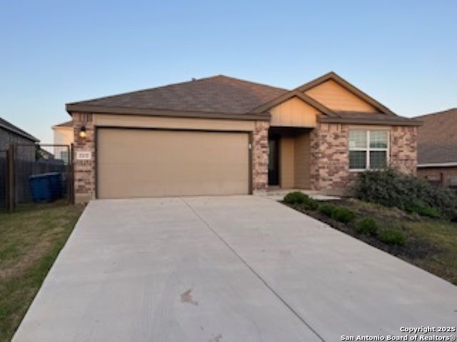 32132 Morels Avenue Bulverde, TX 78163 - Photo 1 of 13 a front view of a house with a yard and garage
