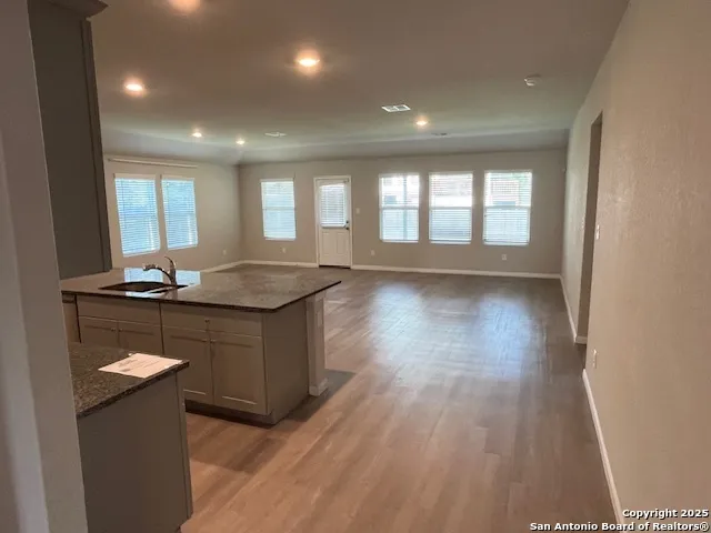 a kitchen with a sink and cabinets
