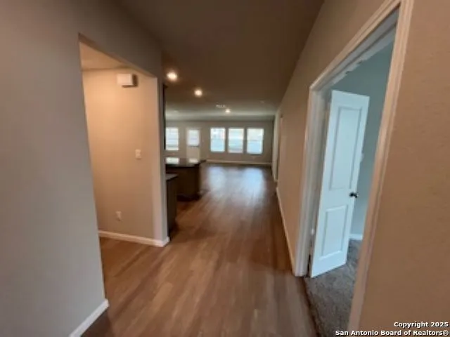 a view of gallery with wooden floor