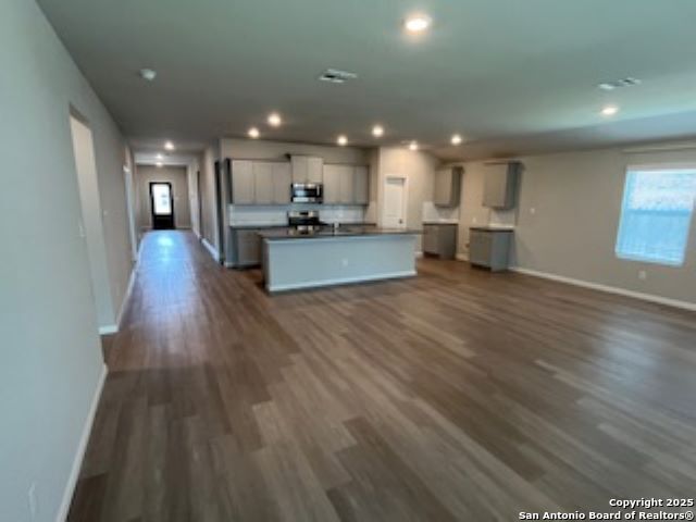 32132 Morels Avenue Bulverde, TX 78163 - Photo 7 of 13 a view of kitchen with cabinets stainless steel appliances with wooden floor