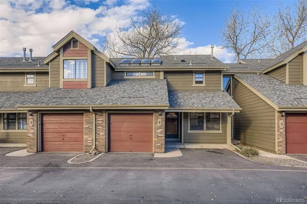 a front view of a house with a garage