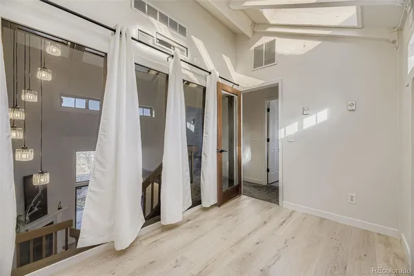 a view of a hallway with a white walls