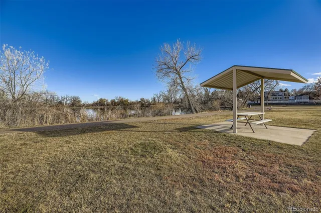 a view of a lake with a house in the background
