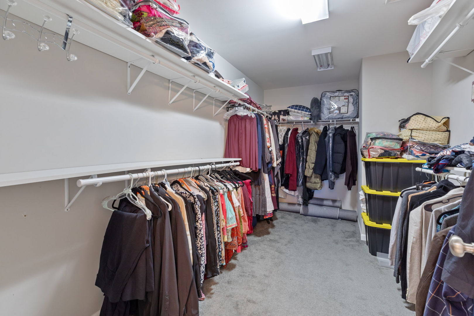 993 Times Square Drive Aurora, IL 60504 - Photo 14 of 26 a view of walk in closet with clothes and shoes