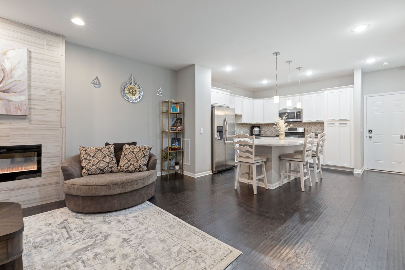 993 Times Square Drive Aurora, IL 60504 - Photo 3 of 26 a living room with furniture and a fireplace