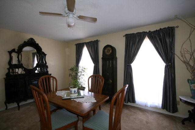 3802 70th Street Lubbock, TX 79413 - Photo 6 of 10 a dining room with furniture and window