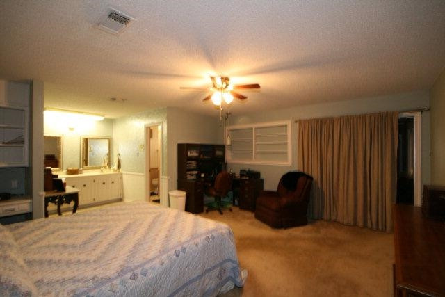 3802 70th Street Lubbock, TX 79413 - Photo 10 of 10 a bedroom with a bed and furniture