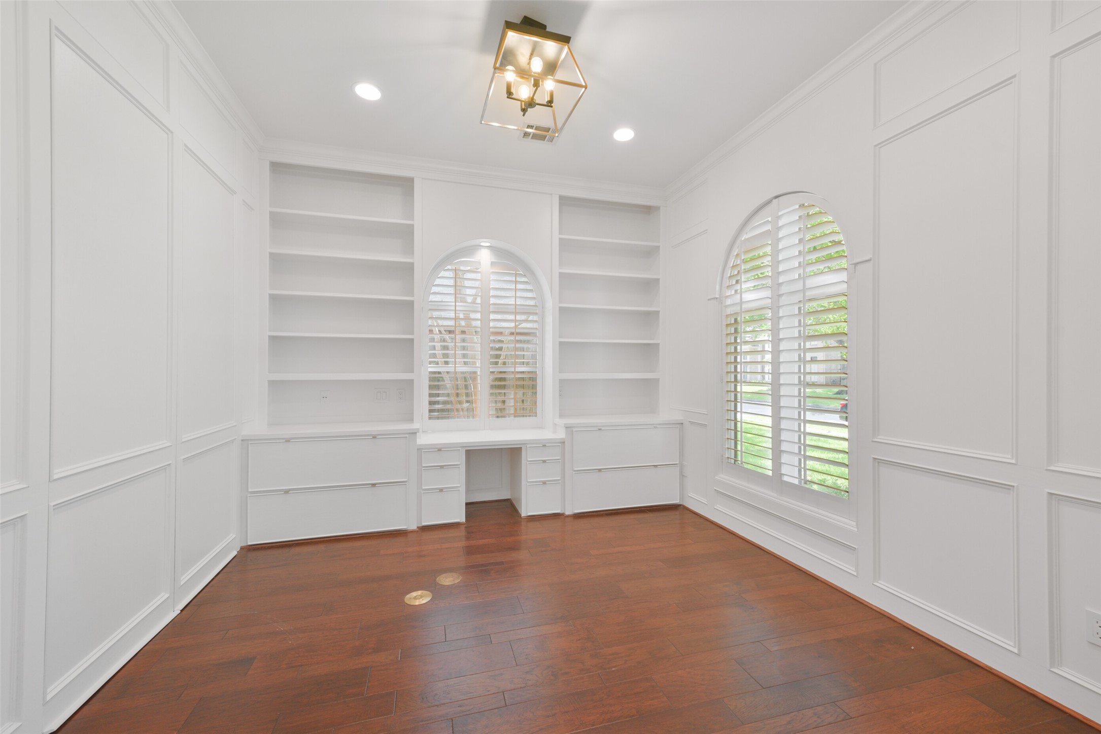3724 Wroxton Road Houston, TX 77005 - Photo 6 of 40 The paneled study with built-in storage and desk overlooks the front of the property.