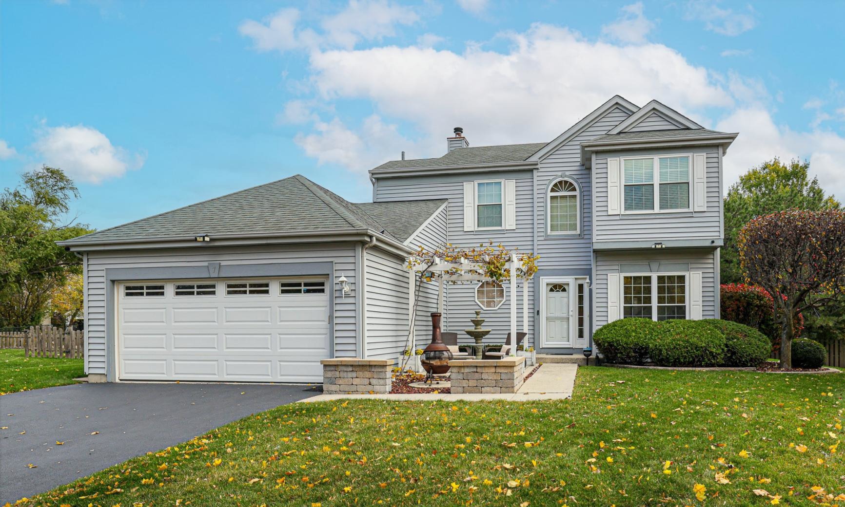 7 Michael Court Lake In The Hills, IL 60156 - Photo 1 of 37 a front view of a house with patio and garden