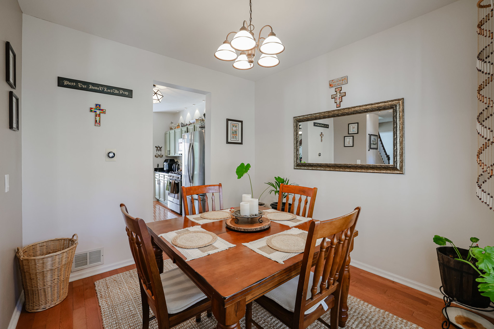 7 Michael Court Lake In The Hills, IL 60156 - Photo 12 of 37 a view of a dining room with furniture a chandelier and wooden floor