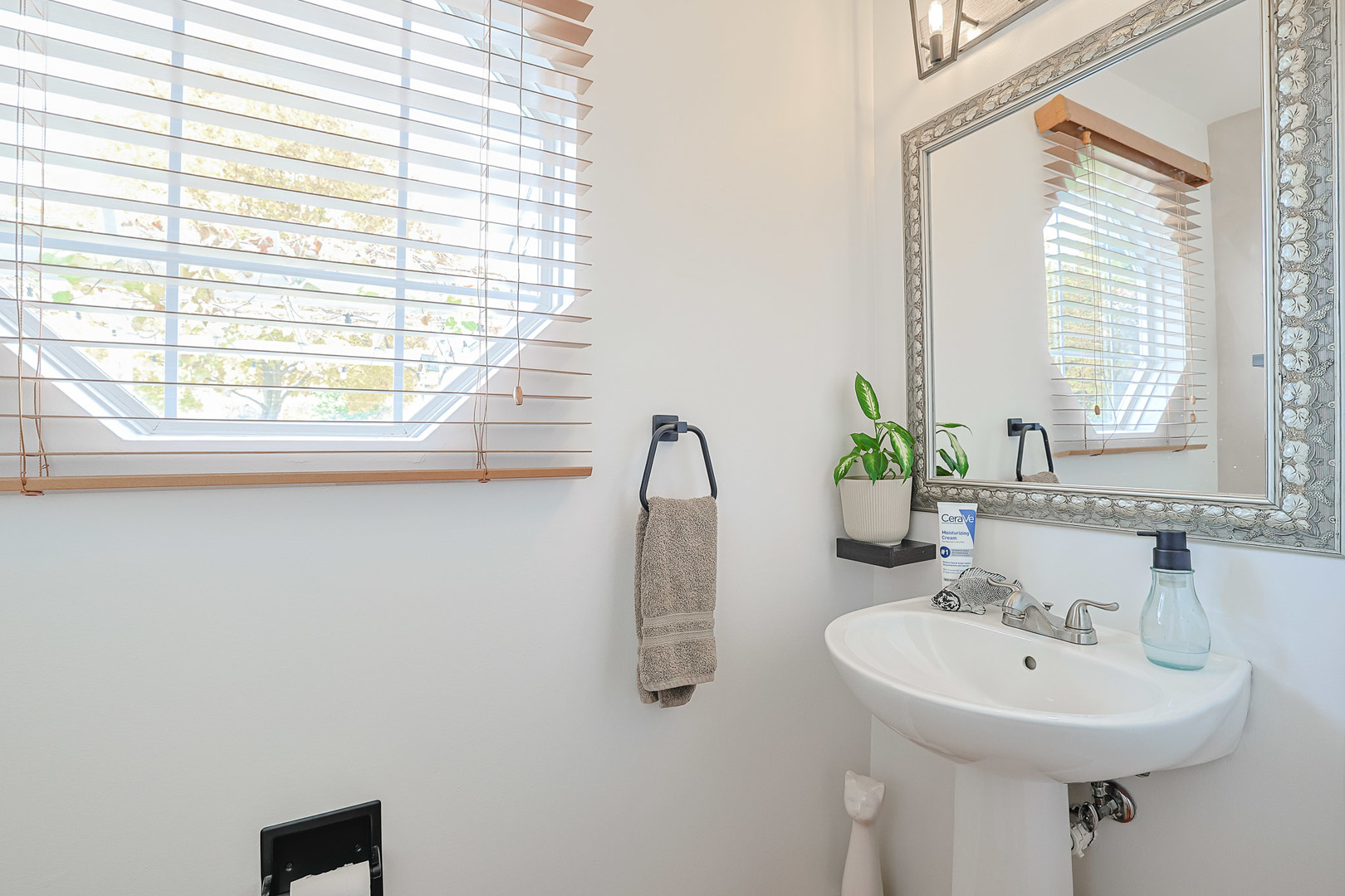 7 Michael Court Lake In The Hills, IL 60156 - Photo 23 of 37 a bathroom with a sink a mirror and window