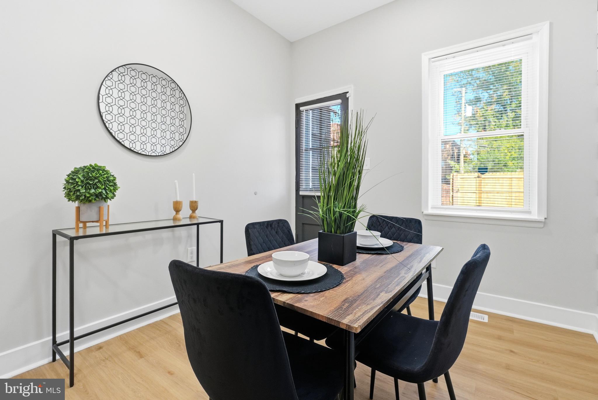 2237 Madison Avenue Baltimore, MD 21217 - Photo 18 of 53 a view of a dining room with furniture and wooden floor
