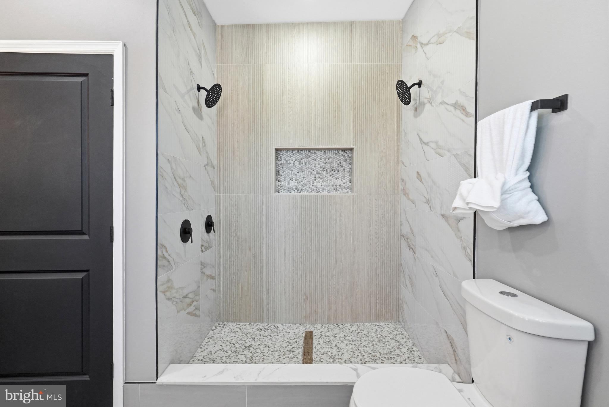 2237 Madison Avenue Baltimore, MD 21217 - Photo 40 of 53 a bathroom with a shower and toilet