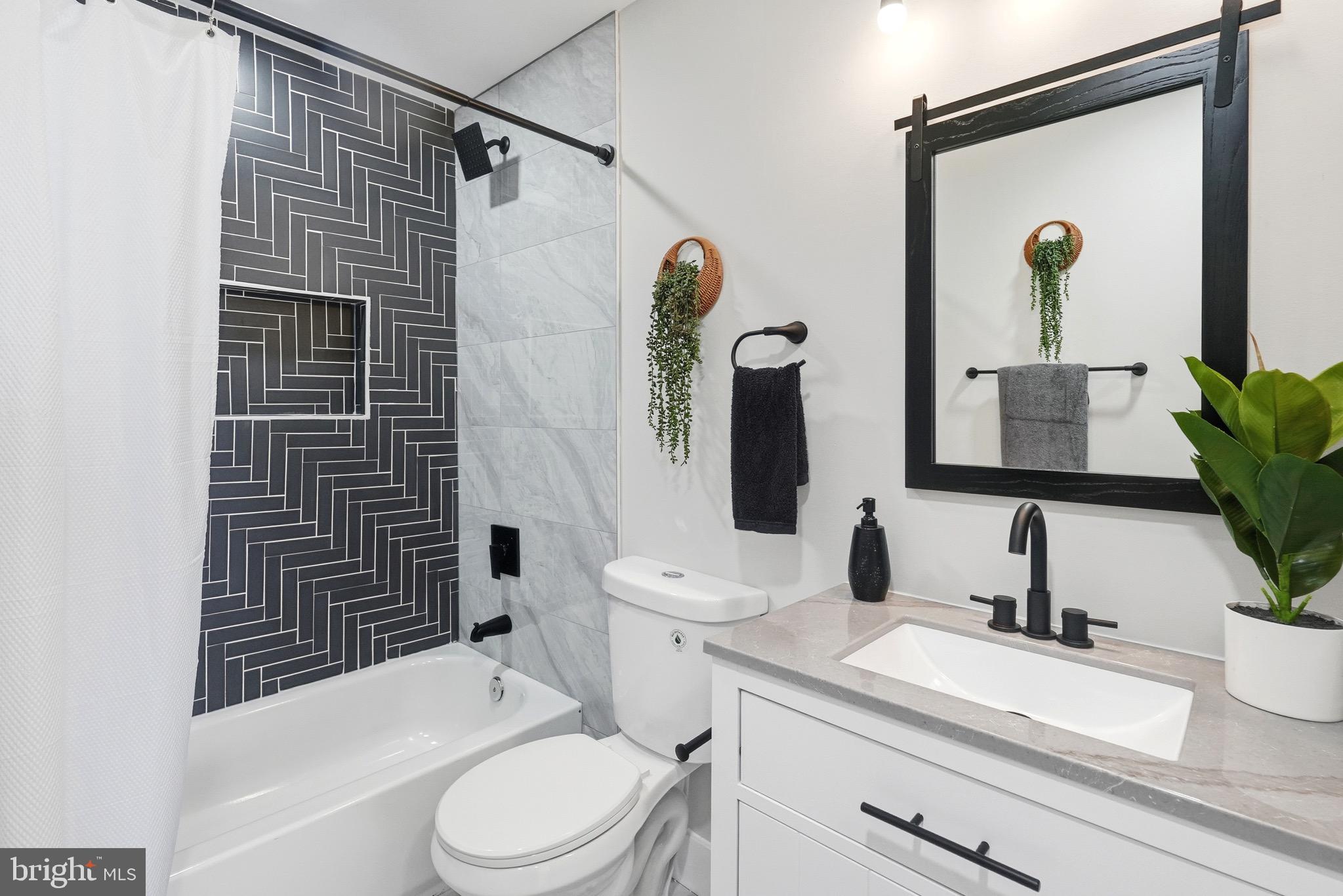 2237 Madison Avenue Baltimore, MD 21217 - Photo 49 of 53 a bathroom with a sink a toilet and shower