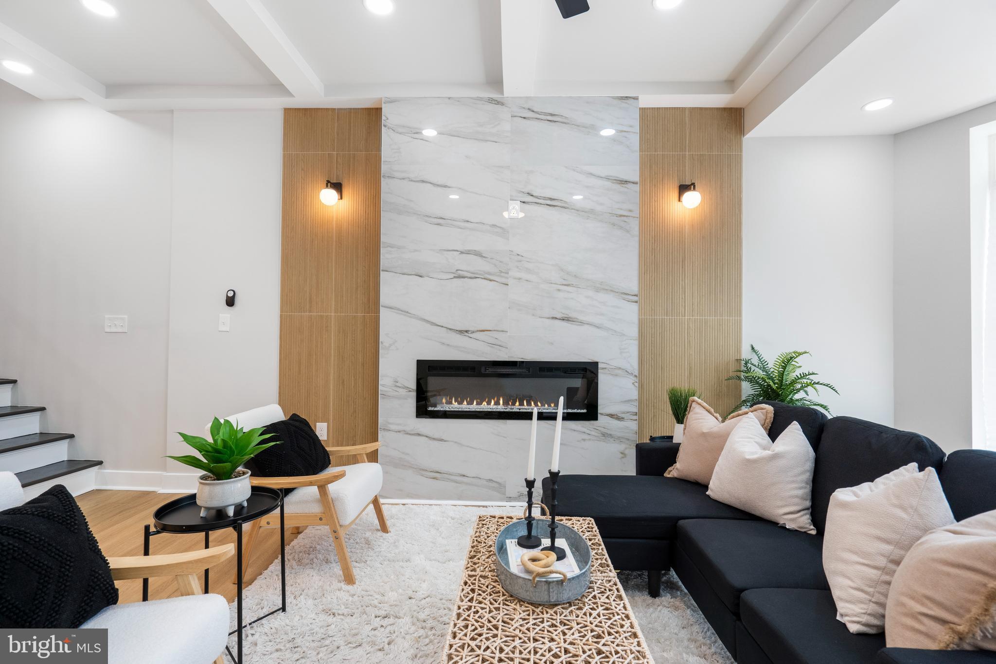 2237 Madison Avenue Baltimore, MD 21217 - Photo 7 of 53 a living room with furniture and a fireplace