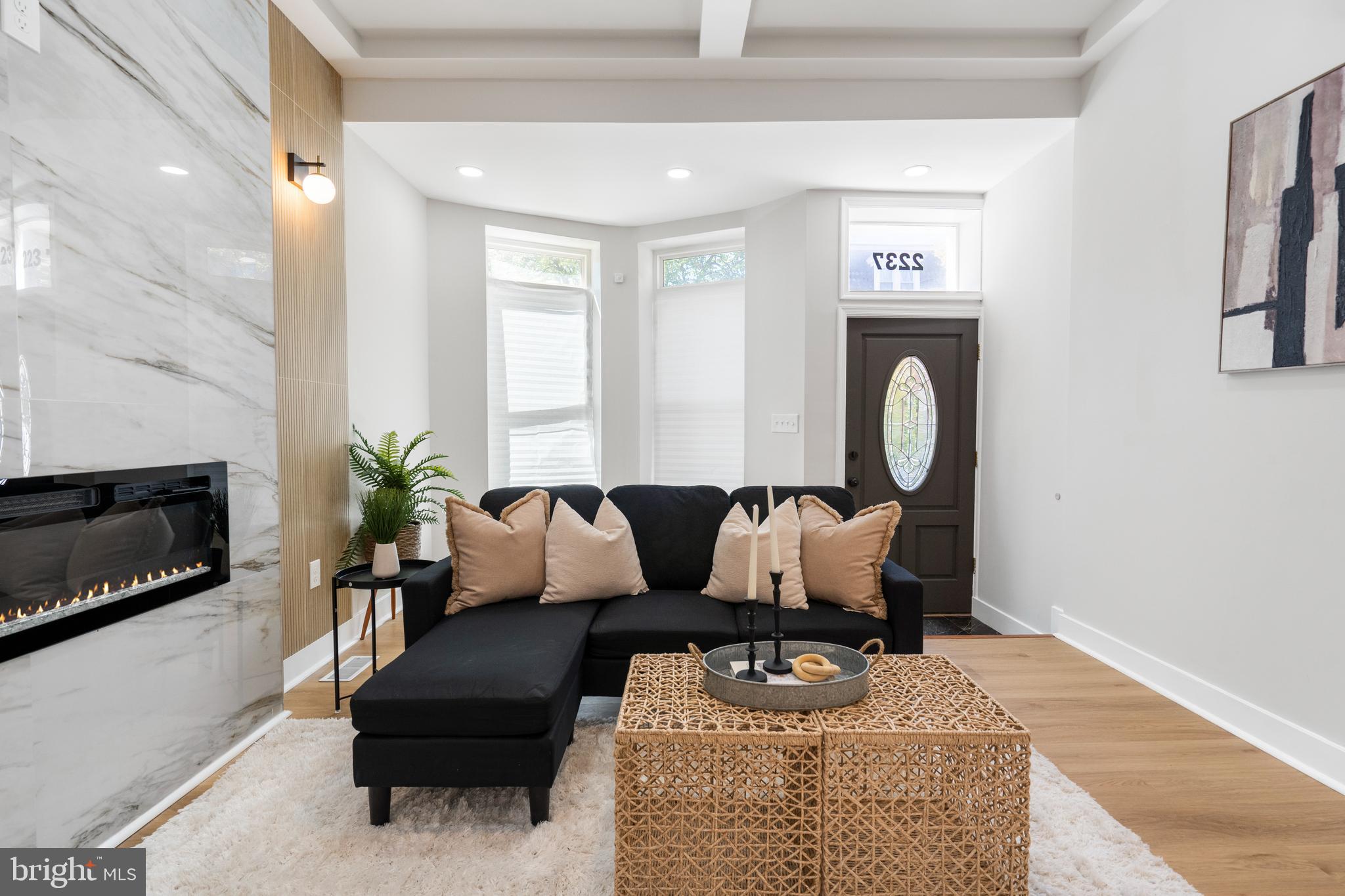 2237 Madison Avenue Baltimore, MD 21217 - Photo 10 of 53 a living room with furniture a flat screen tv and a fireplace