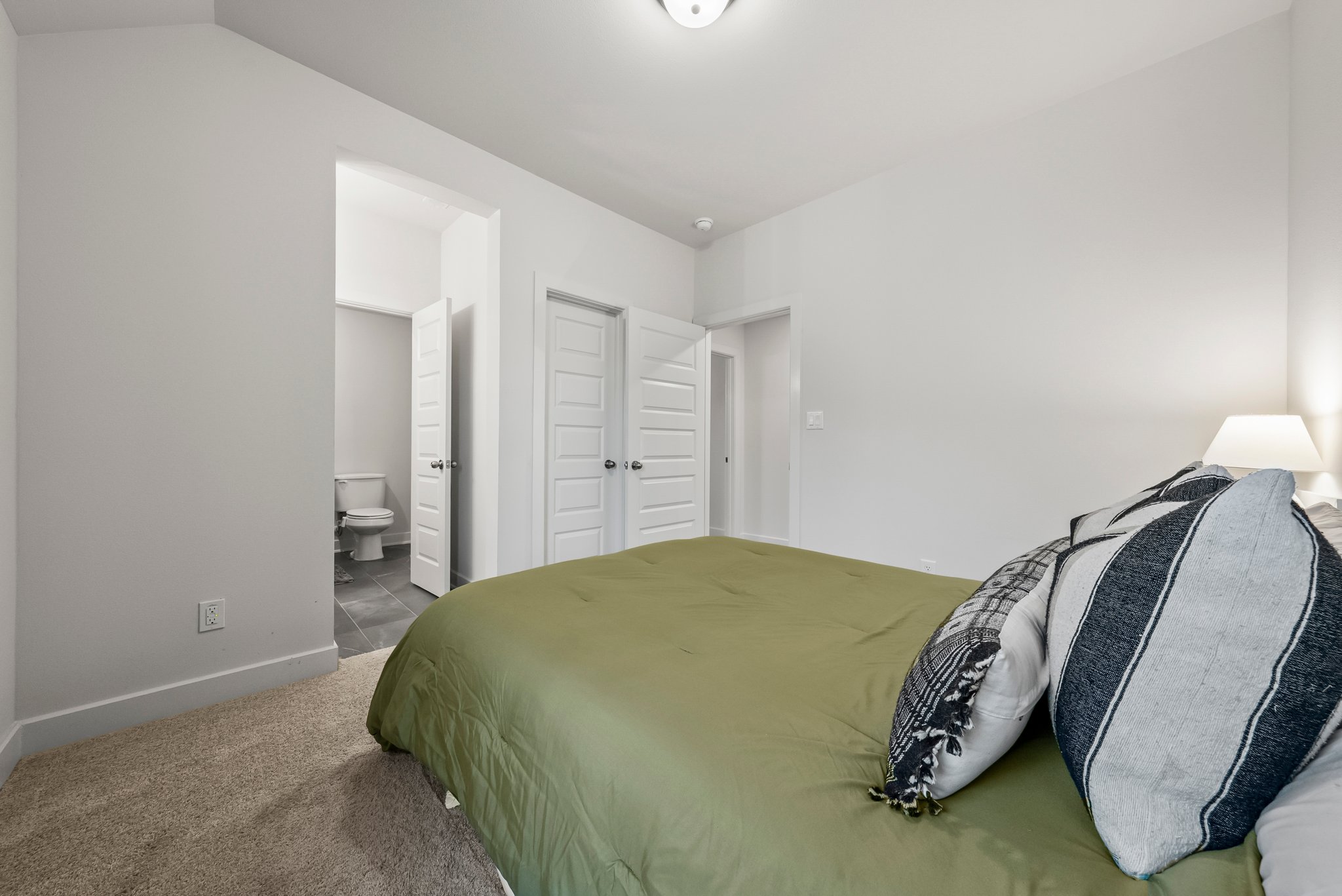 124 Low River Lane Georgetown, TX 78628 - Photo 30 of 38 a bedroom with a bed and a chair