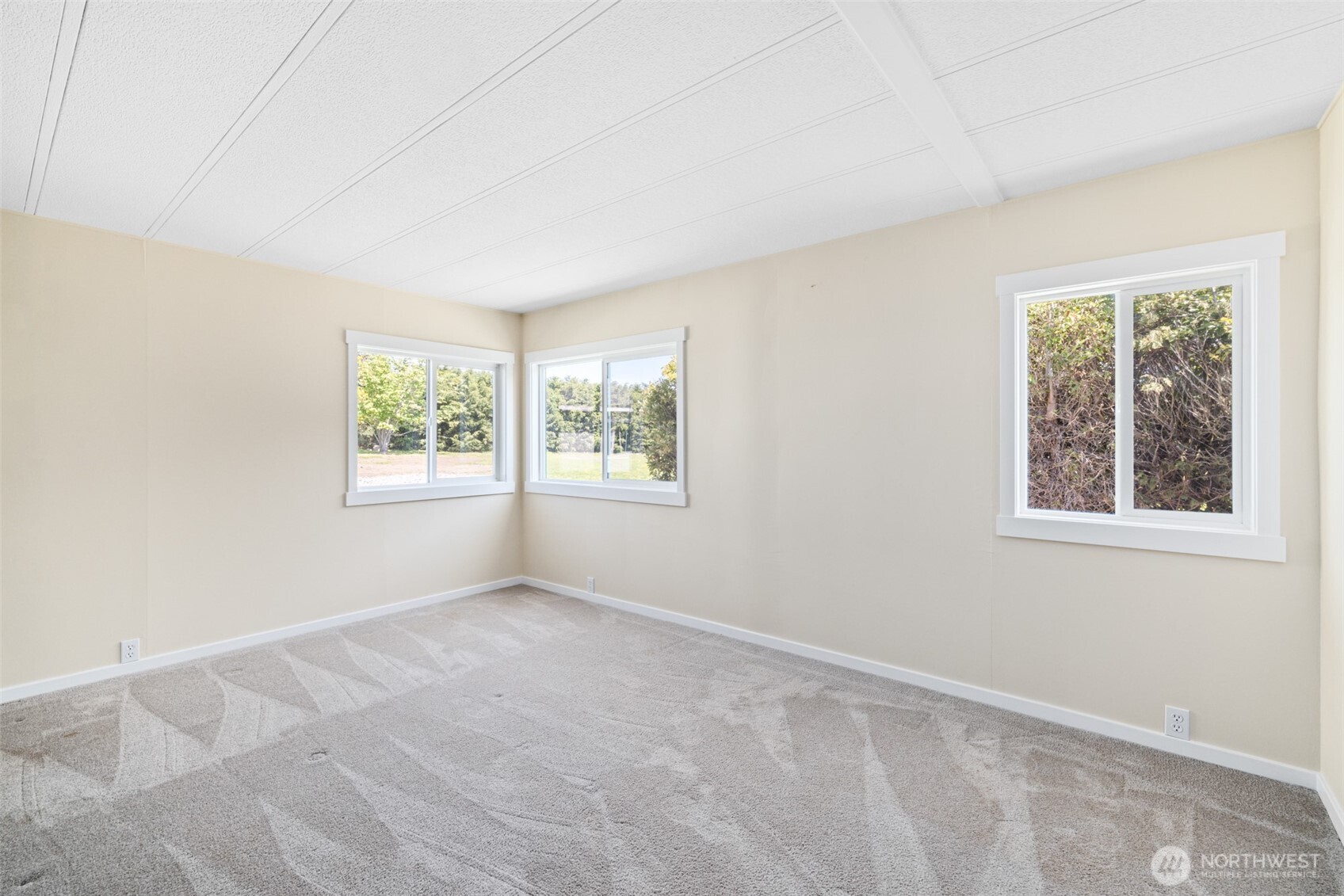 360 Mountain View Drive Sequim, WA 98382 - Photo 19 of 39 an empty room with windows