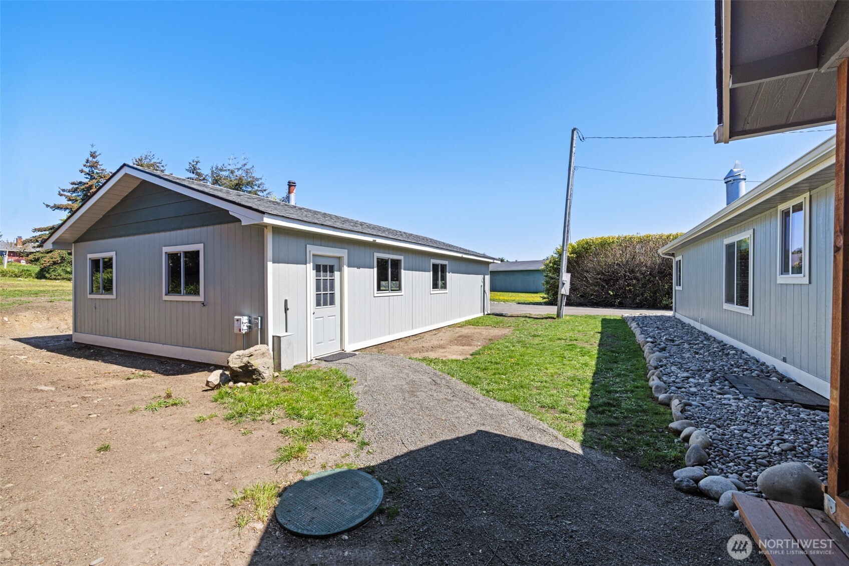 360 Mountain View Drive Sequim, WA 98382 - Photo 28 of 39 a front view of a house with garden