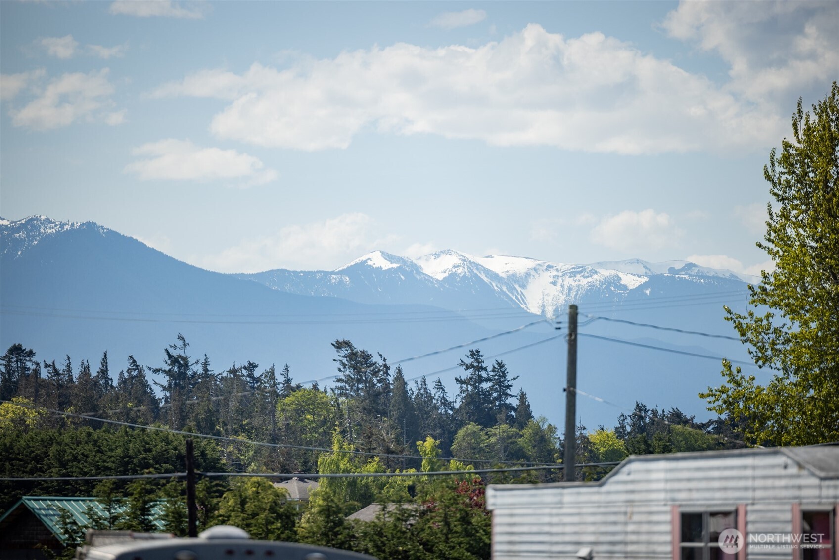 360 Mountain View Drive Sequim, WA 98382 - Photo 39 of 39 a view of a city with lush green forest