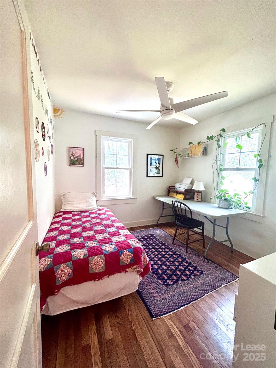 15 Pruitt Street Asheville, NC 28806 - Photo 11 of 19 a bedroom with a bed and wooden floor
