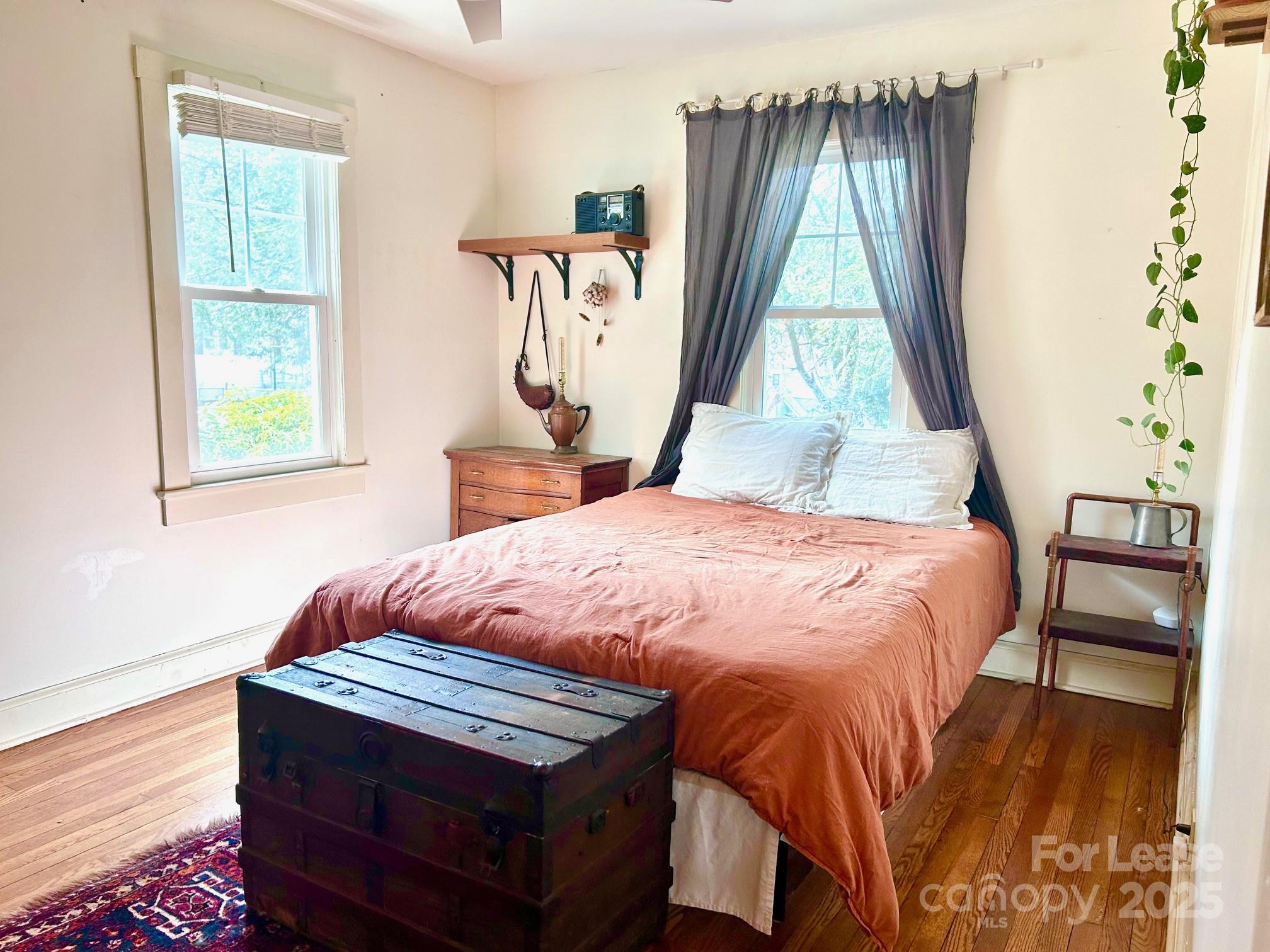 15 Pruitt Street Asheville, NC 28806 - Photo 10 of 19 a bedroom with a bed and a window
