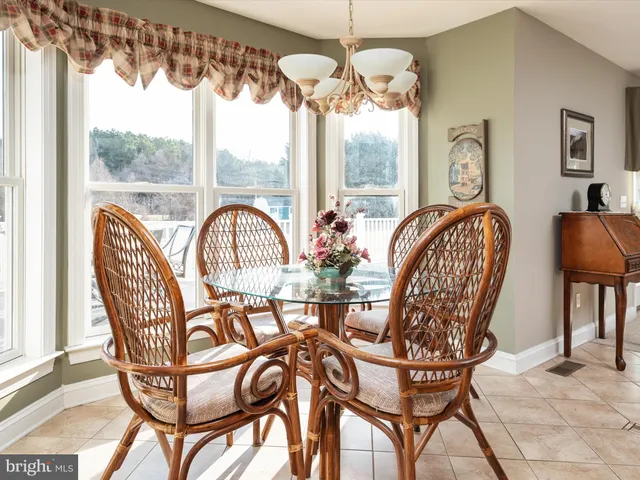 a view of a kitchen with stainless steel appliances granite countertop a refrigerator and a sink
