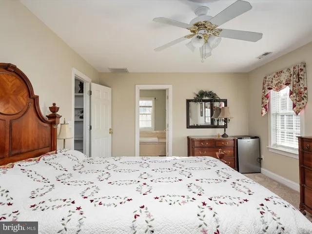 a bathroom with bathtub and window