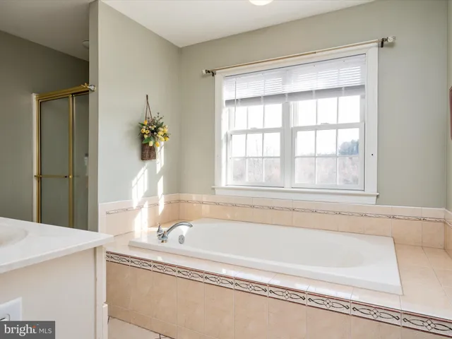 a bathroom with a sink double vanity and a mirror