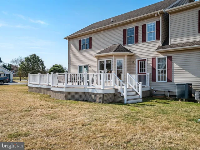 a front view of a house with a small yard