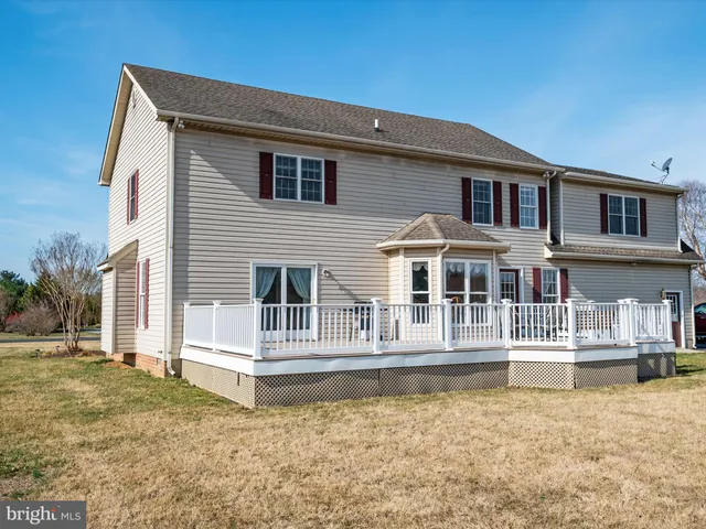 a view of house with seating space and hardwood