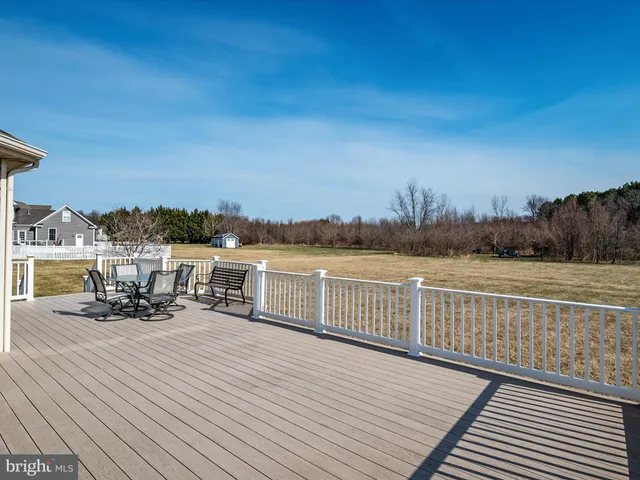 a view of a chairs on wooden deck