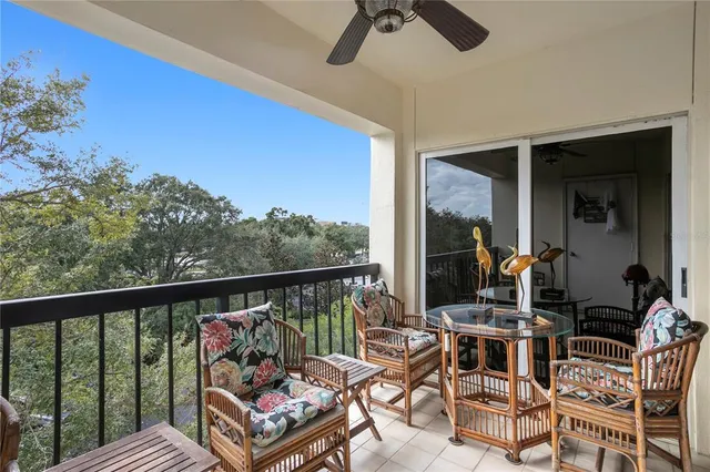a view of a chairs and table in patio