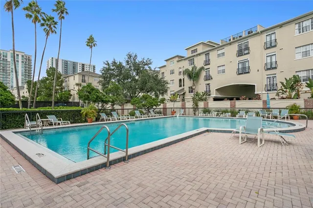 a view of a patio with a table and chairs