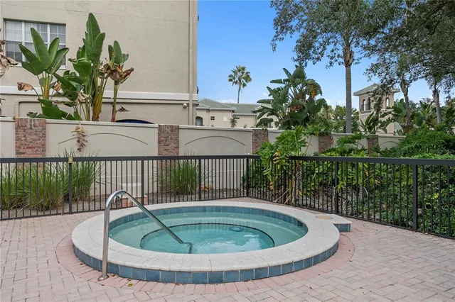 a small pool with a table and chairs