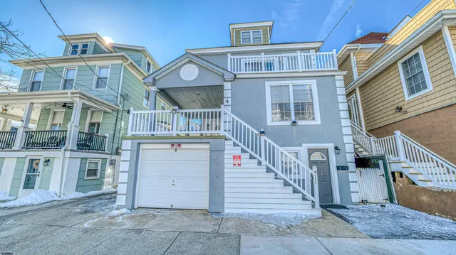 a view of a brick house with many windows
