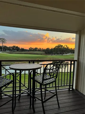 a view of a chairs on wooden deck