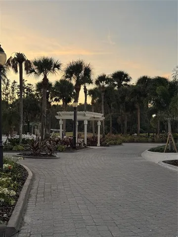 a view of a street with a building in the background